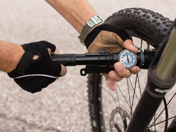 Man inflating e-bike tire