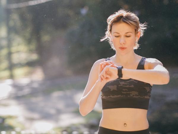 Woman using smartwatch during workout