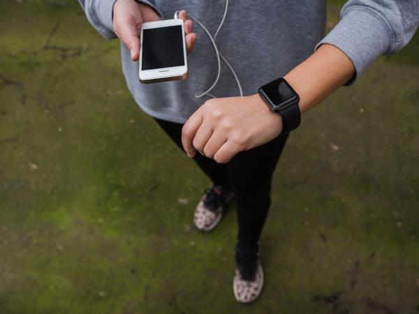 Woman using smartwatch during workout