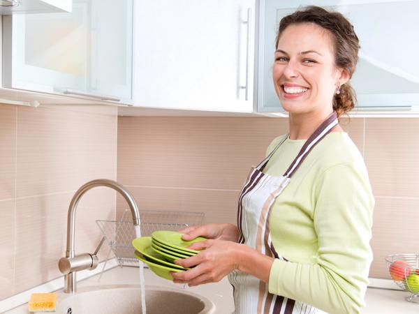 Woman washing dishes