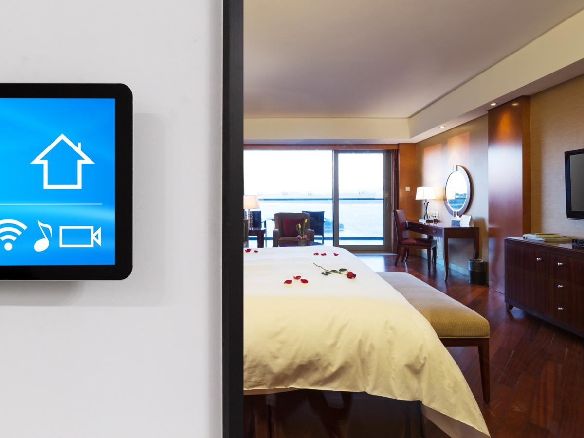 Smart home control panel in modern bedroom