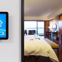 Smart home control panel in modern bedroom