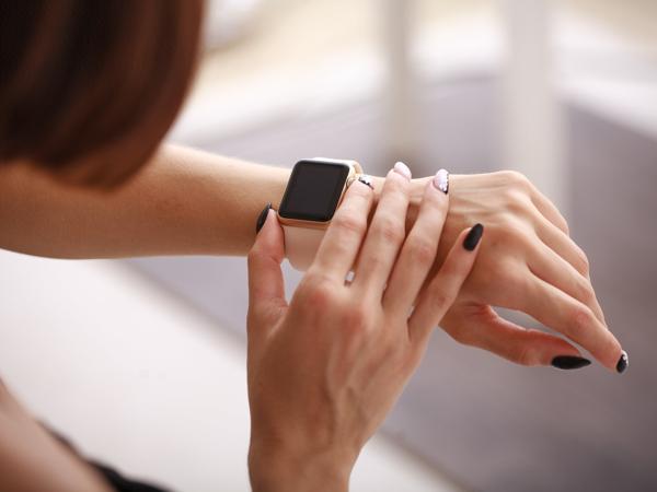 Woman using Apple Watch