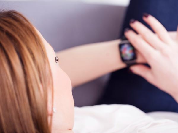 Woman checking smartwatch