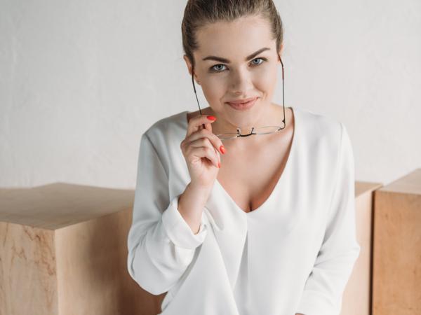 Businesswoman working on laptop at standing desk